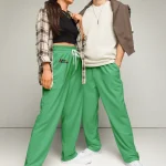 wild peach clothing | Green confetti track pants | Front view