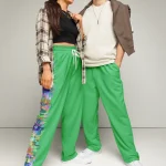wild peach clothing design 06 emerald green unisex track pants front 1